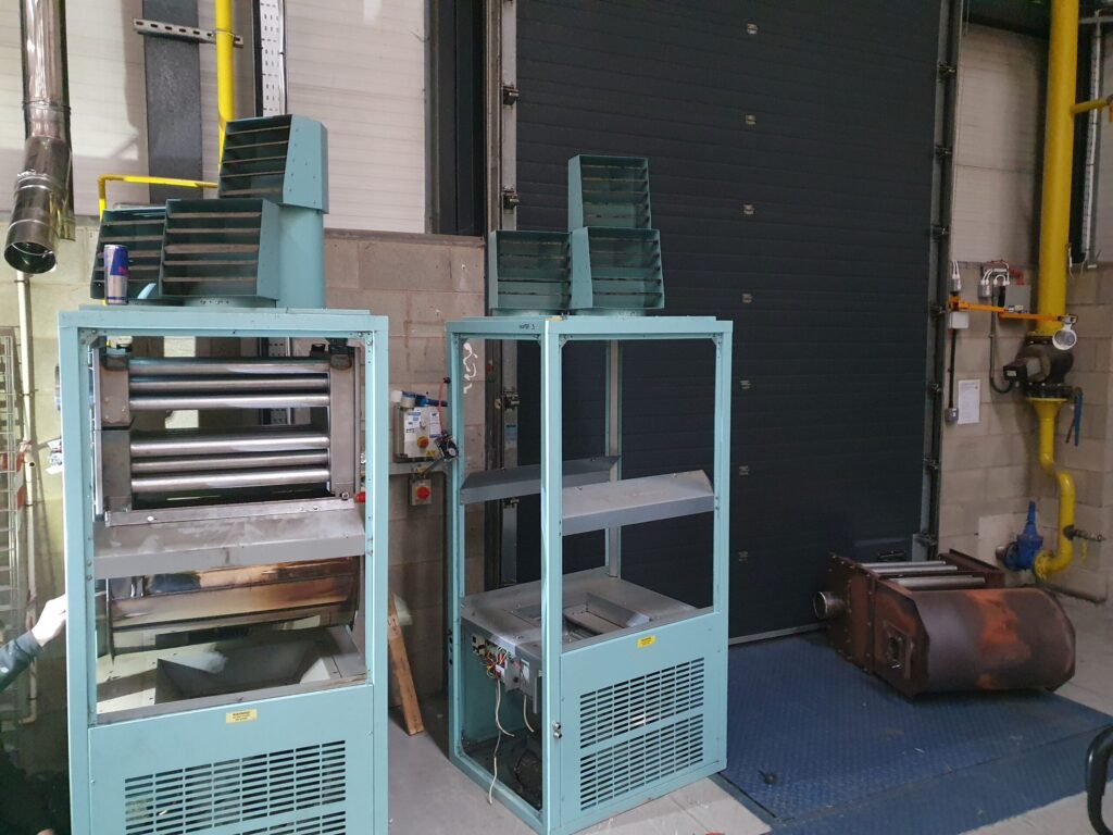 Commercial warm-air heating units opened for servicing